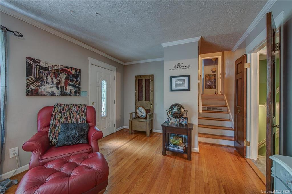 912 Parkwood Road Shelby, NC 28150 - Photo 5 of 23 a bedroom with furniture and a wooden floor