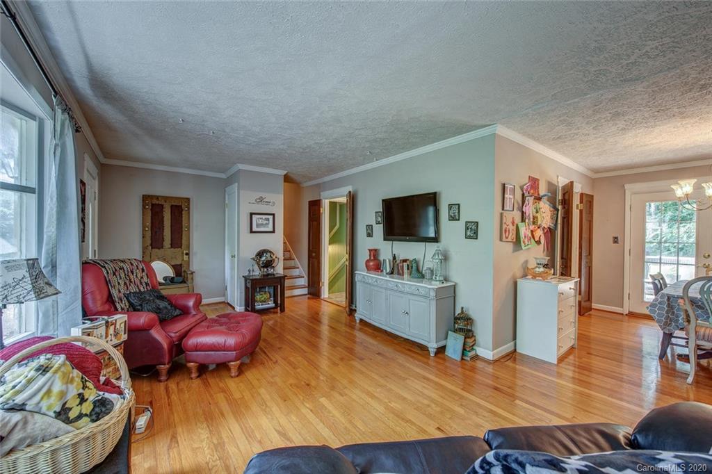 912 Parkwood Road Shelby, NC 28150 - Photo 8 of 23 a living room with furniture and a flat screen tv