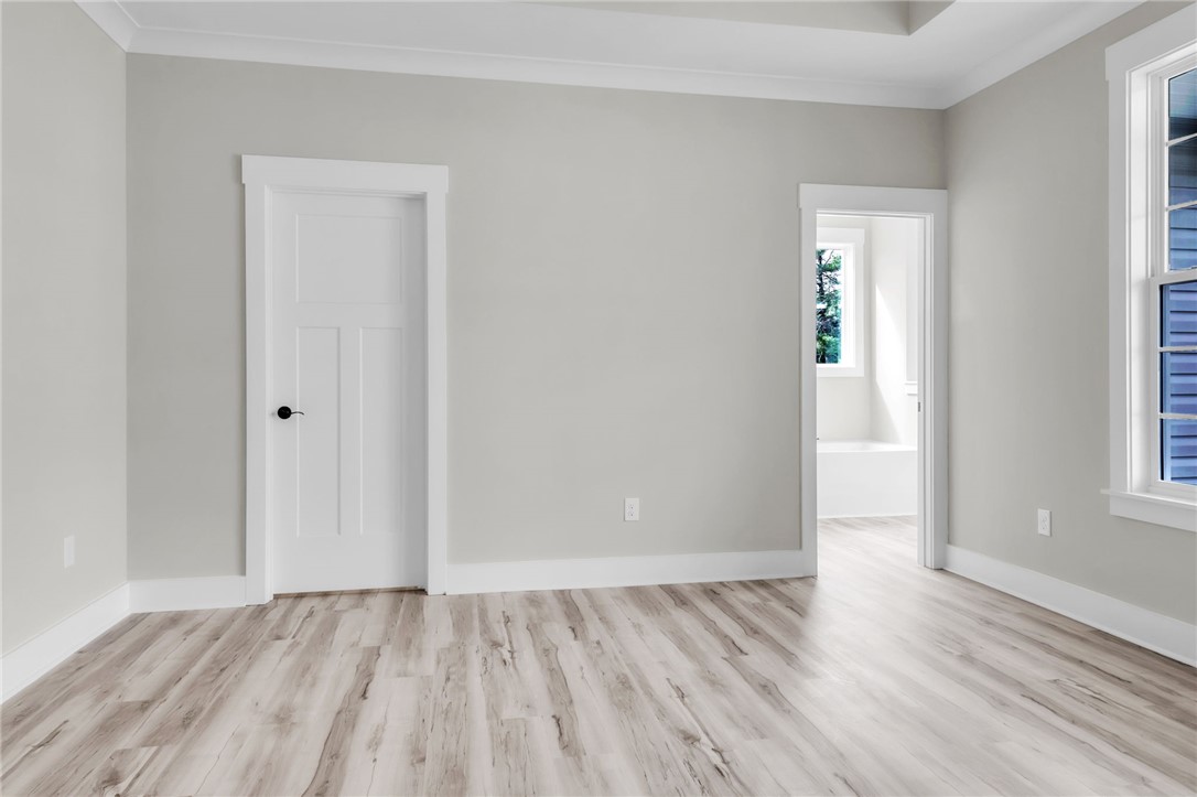 121 Ashley Drive Pelzer, SC 29669 - Photo 12 of 25 Empty room featuring crown molding and light wood-style flooring