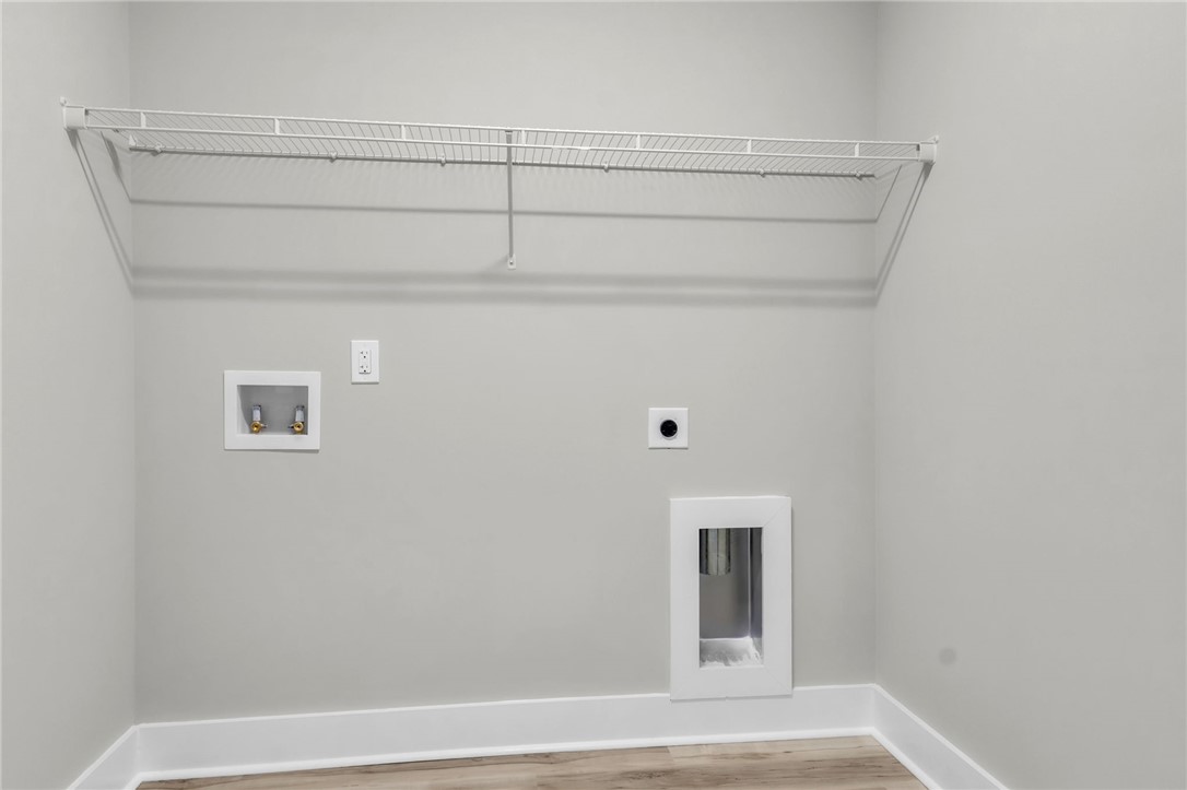 121 Ashley Drive Pelzer, SC 29669 - Photo 17 of 25 Washroom with wood finished floors, hookup for a washing machine, and hookup for an electric dryer