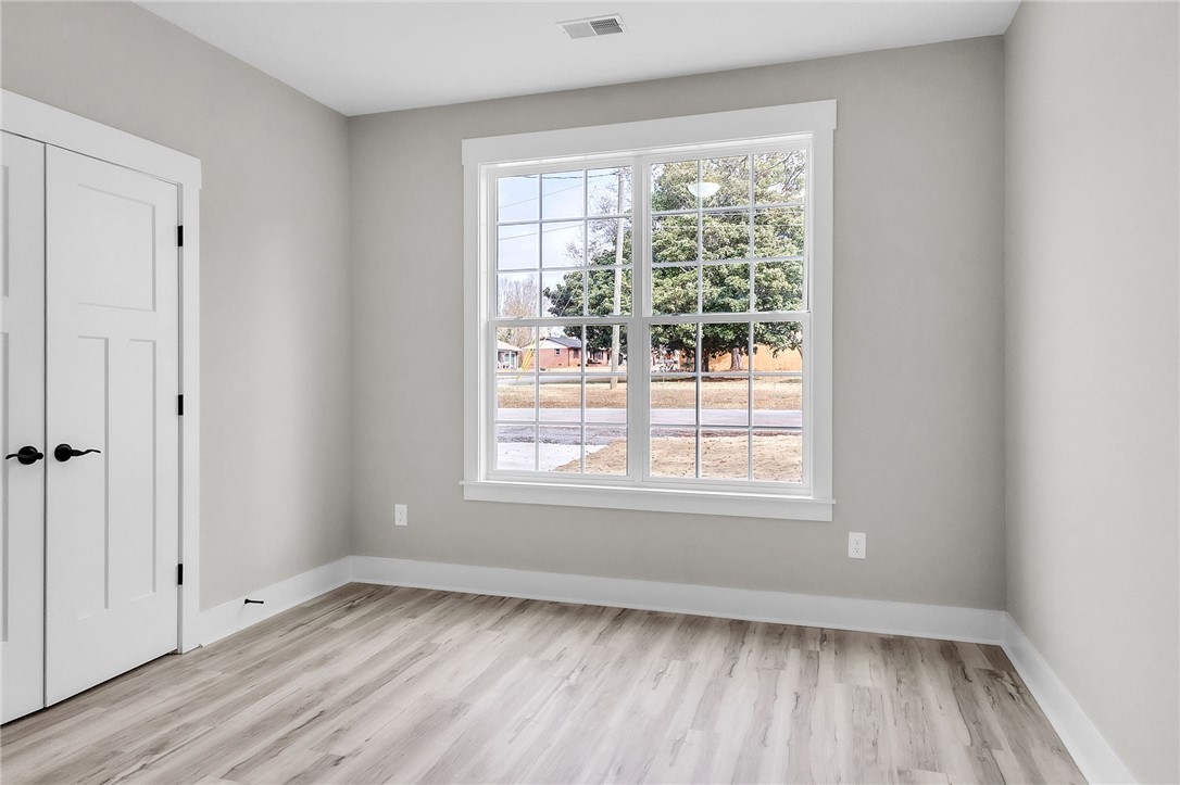 121 Ashley Drive Pelzer, SC 29669 - Photo 20 of 25 Unfurnished room with baseboards and light wood-type flooring