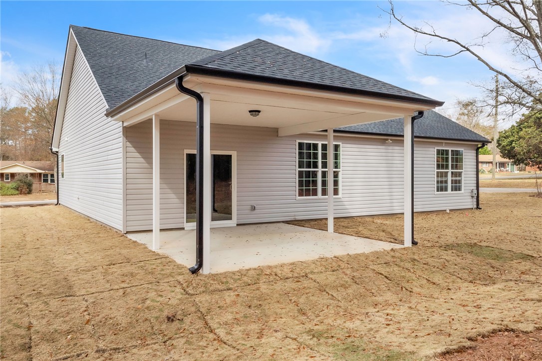 121 Ashley Drive Pelzer, SC 29669 - Photo 23 of 25 Back of house with roof with shingles and a patio