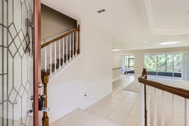 a view of hallway with livingroom and furniture