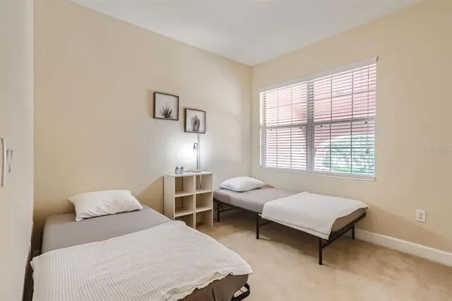 a bathroom with a double vanity sink a toilet and a mirror