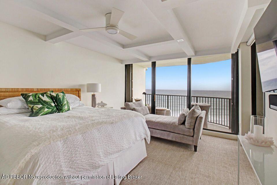 400 South Beach Road, Unit 504 Tequesta, FL 33469 - Photo 11 of 22 a spacious bedroom with a bed and a large window
