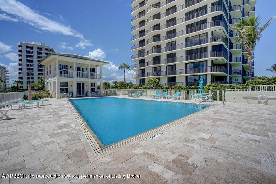 400 South Beach Road, Unit 504 Tequesta, FL 33469 - Photo 17 of 22 a view of a building with a swimming pool