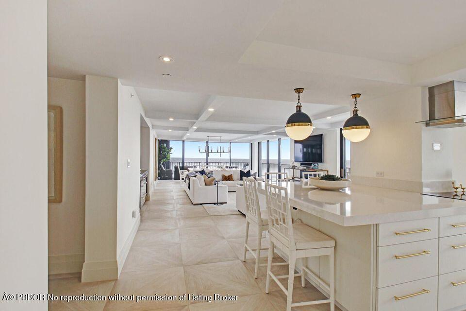 400 South Beach Road, Unit 504 Tequesta, FL 33469 - Photo 5 of 22 a very nice looking room with a large window and chandelier