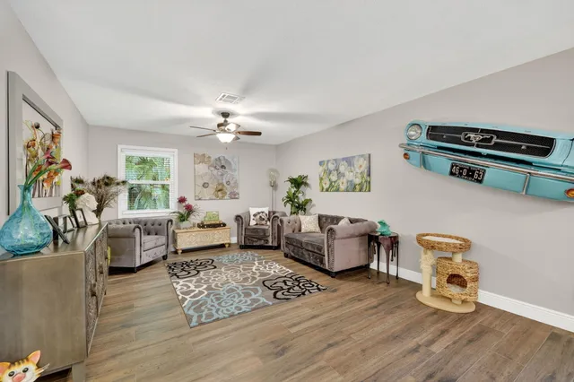 a view of an entryway with wooden floor