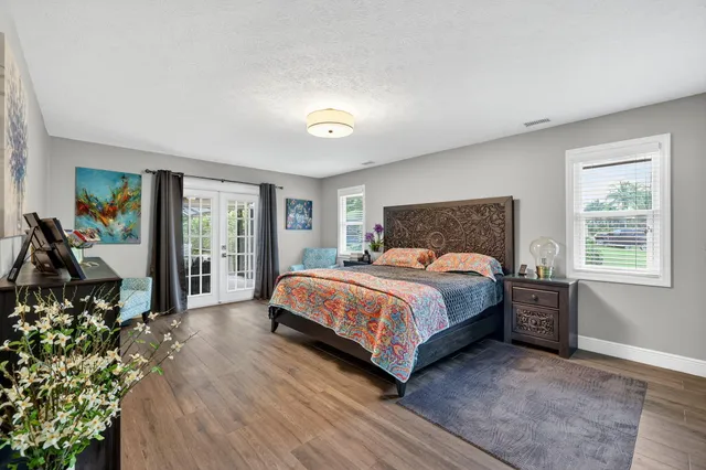 a bedroom with a bed and a couch