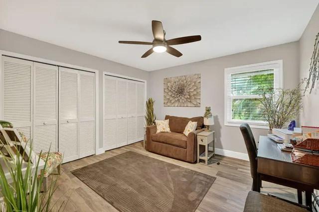 a view of a sink and cabinets in a room