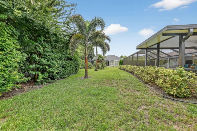 an aerial view of residential house with outdoor space and street view