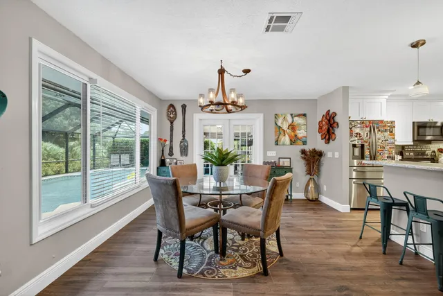 a view of a livingroom with furniture window and wooden floor