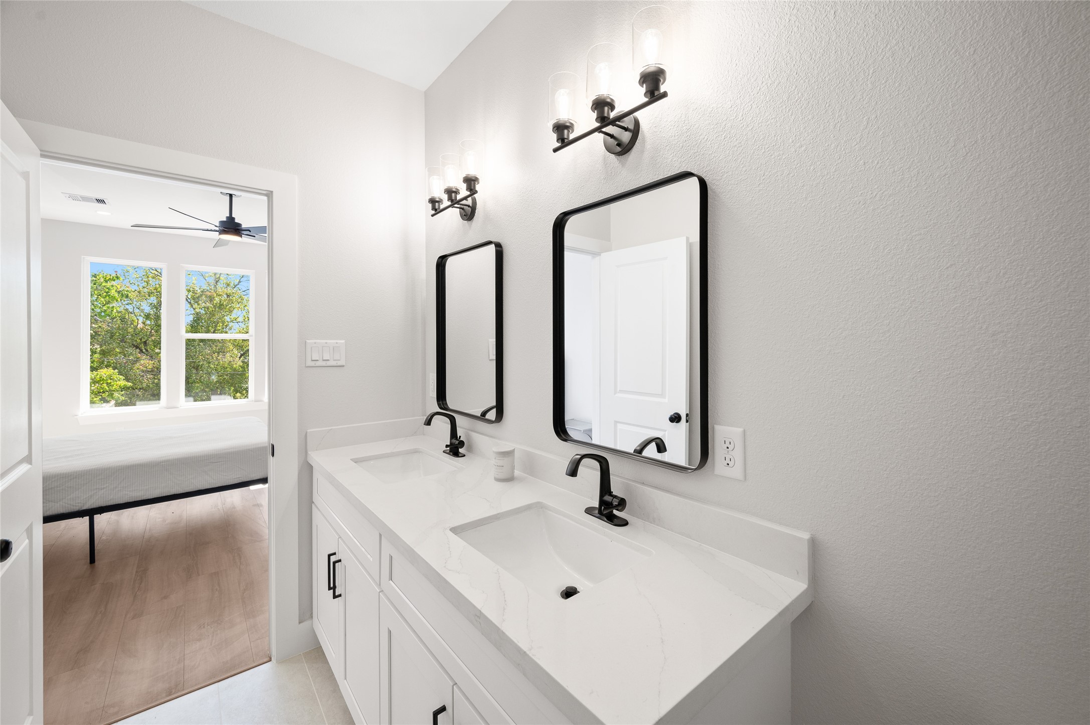 921 East 38th Street Houston, TX 77022 - Photo 27 of 40 a bathroom with a sink and a mirror