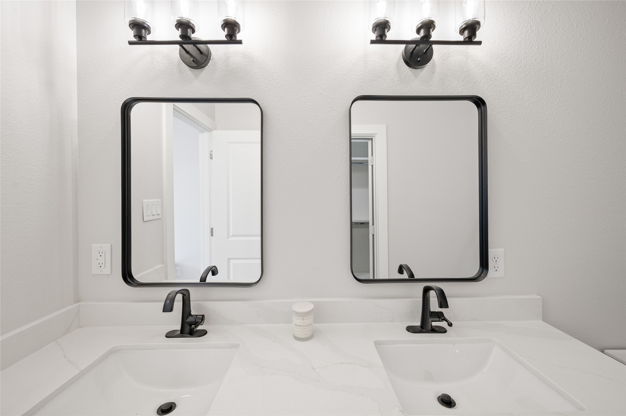 921 East 38th Street Houston, TX 77022 - Photo 30 of 40 a bathroom with two sinks and a mirror