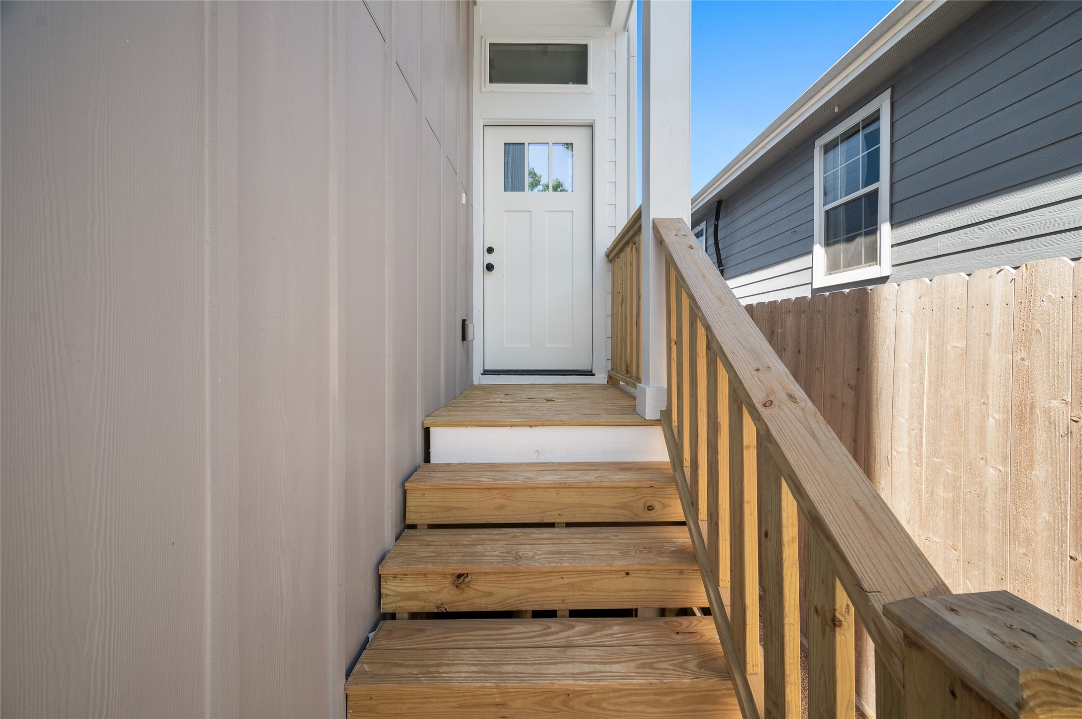 921 East 38th Street Houston, TX 77022 - Photo 3 of 40 a view of staircase with wooden floor and white walls