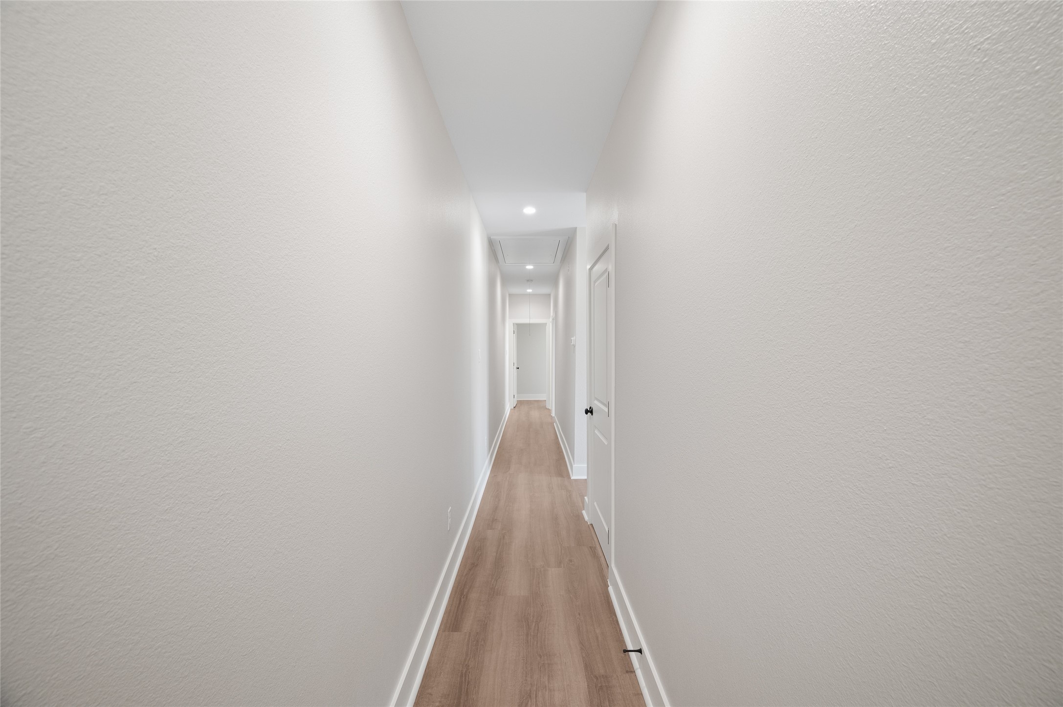 921 East 38th Street Houston, TX 77022 - Photo 31 of 40 a view of a hallway with wooden floor