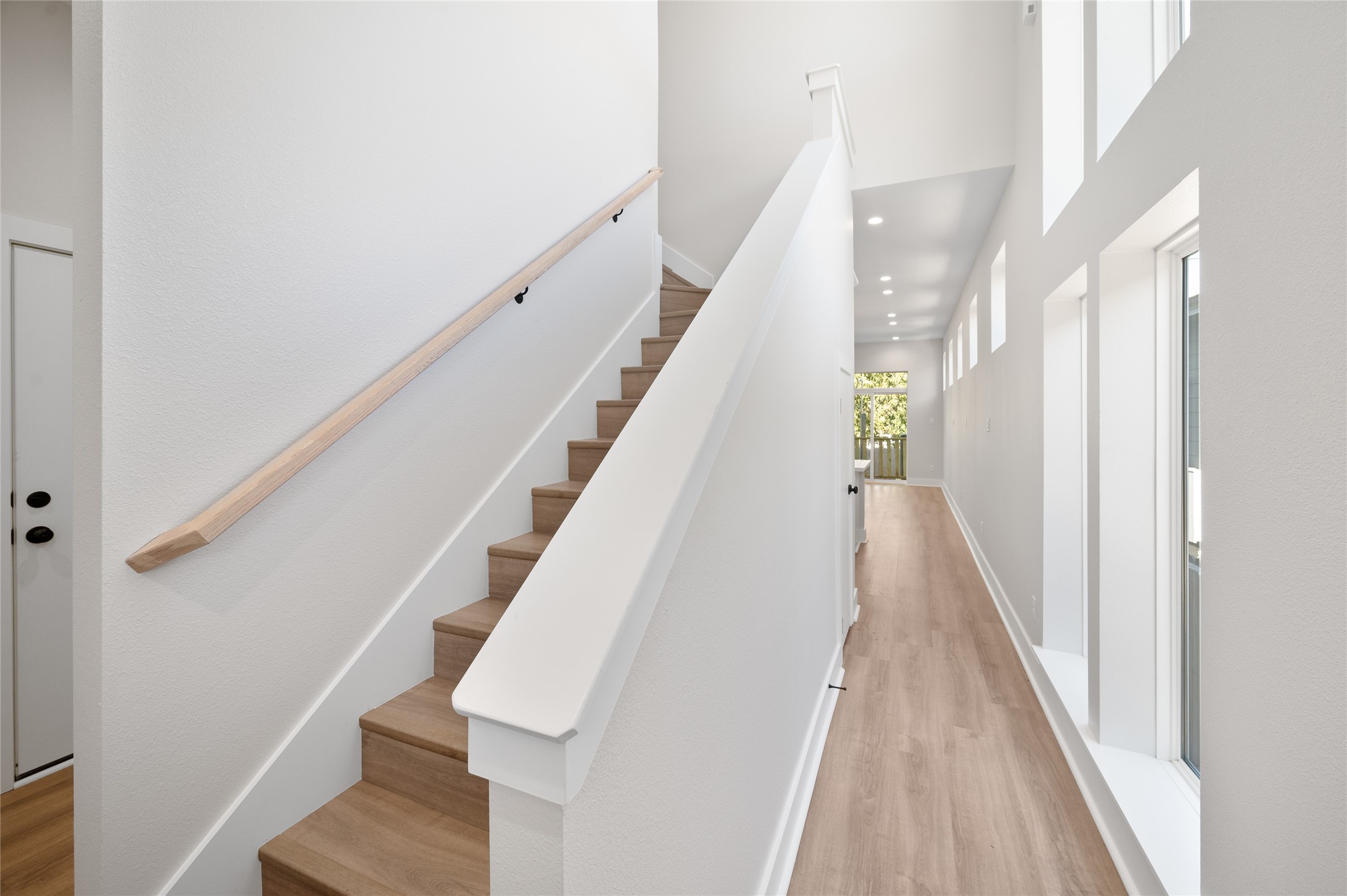 921 East 38th Street Houston, TX 77022 - Photo 5 of 40 a view of entryway and hall with wooden floor
