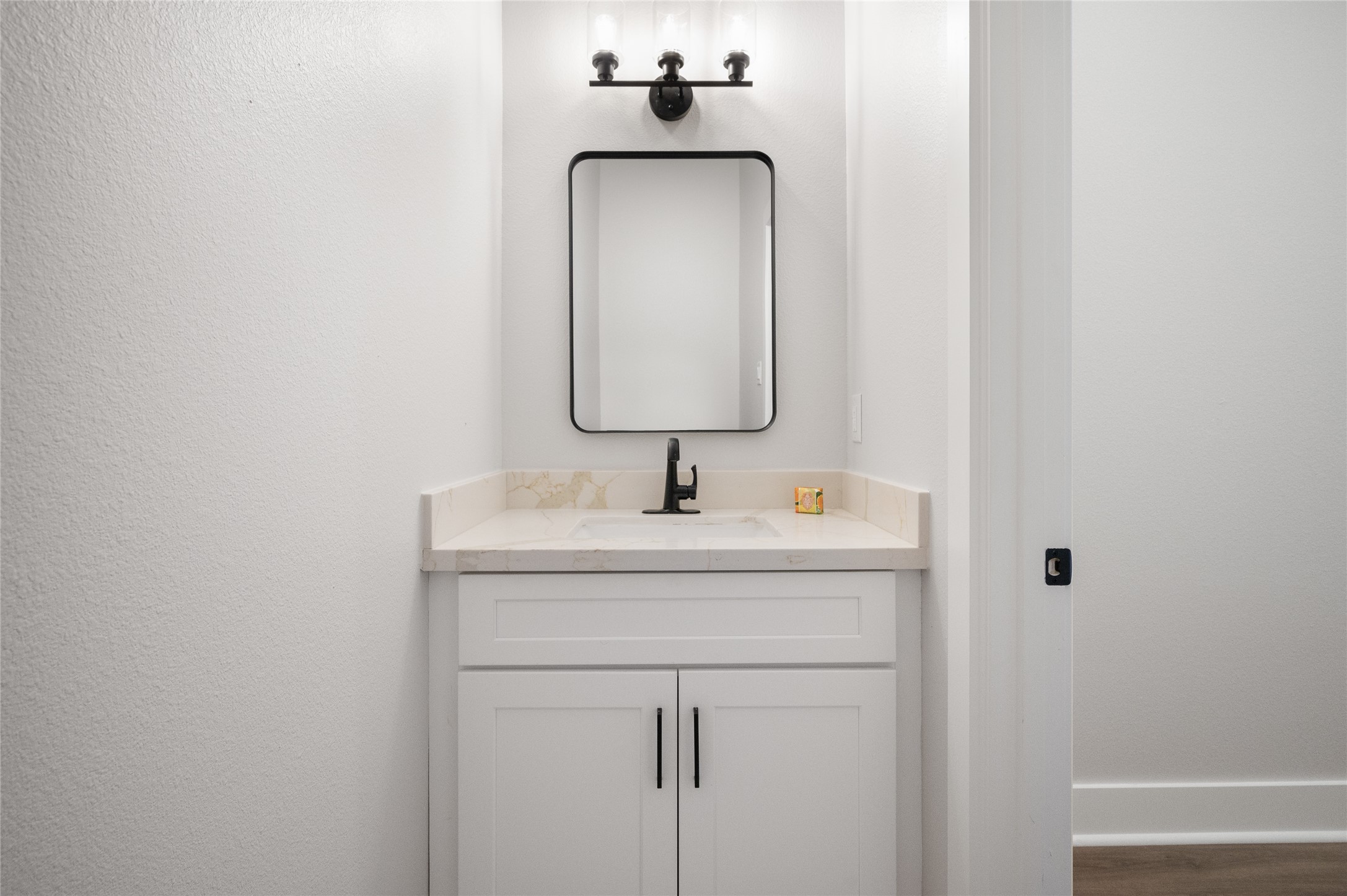 921 East 38th Street Houston, TX 77022 - Photo 7 of 40 a bathroom with a sink and a mirror