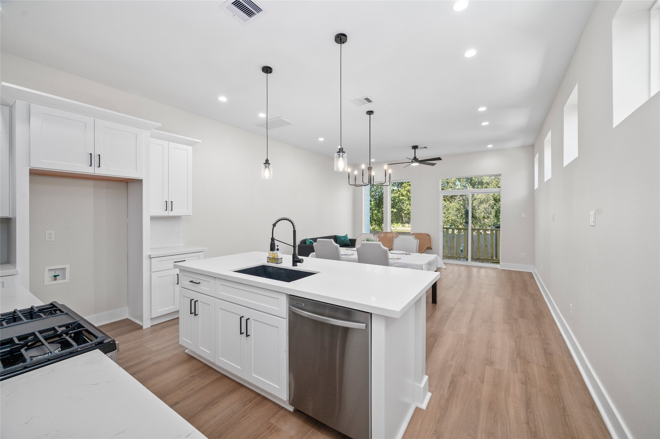 921 East 38th Street Houston, TX 77022 - Photo 9 of 40 a kitchen with a sink stove and cabinets