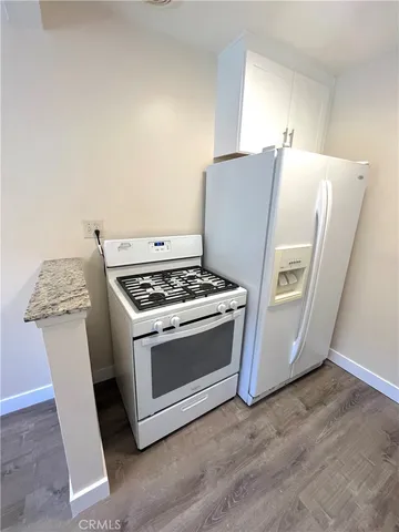 a kitchen with a stove and a microwave