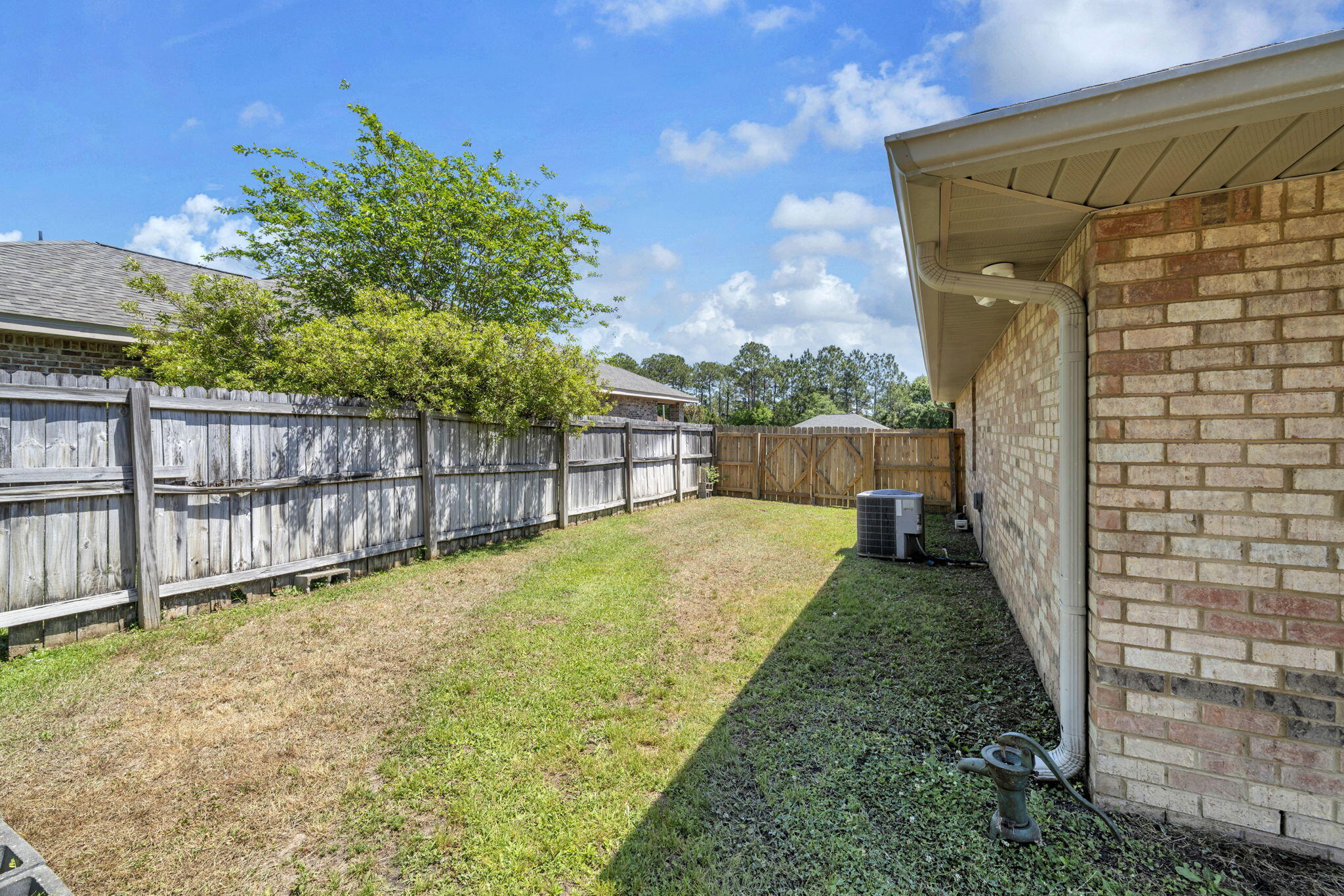 217 Raptor Drive Crestview, FL 32536 - Photo 47 of 48 a view of a yard with wooden fence