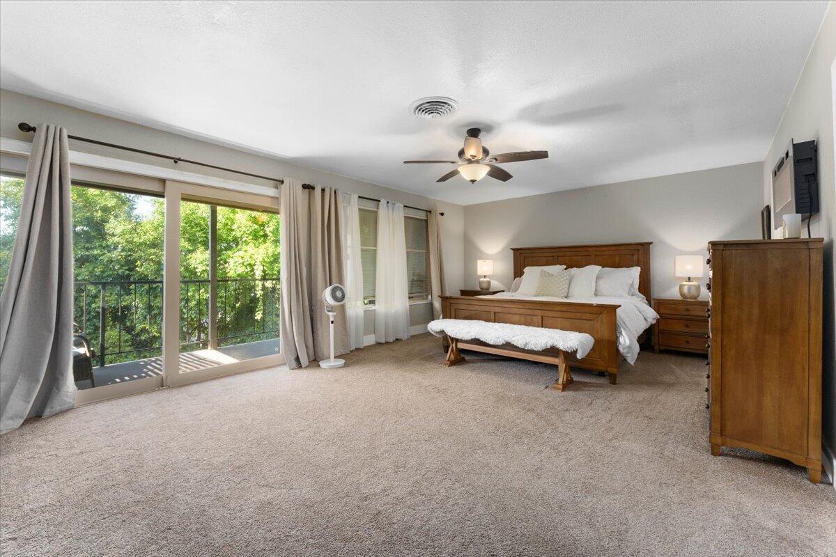 1968 Bechelli Lane Redding, CA 96002 - Photo 12 of 32 a bed room with a bed and a large window