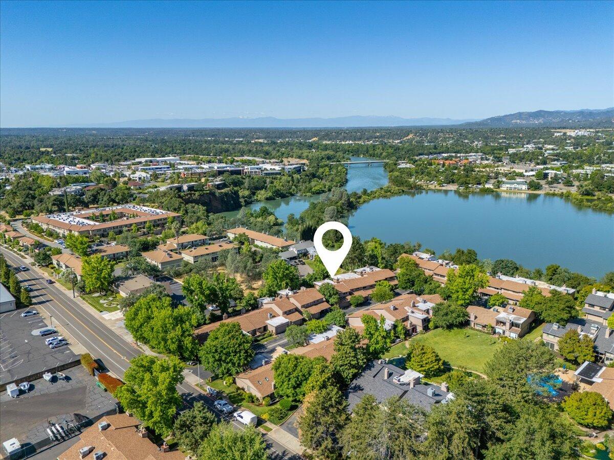 1968 Bechelli Lane Redding, CA 96002 - Photo 2 of 32 an aerial view of a city with lots of residential buildings ocean and mountain view in back