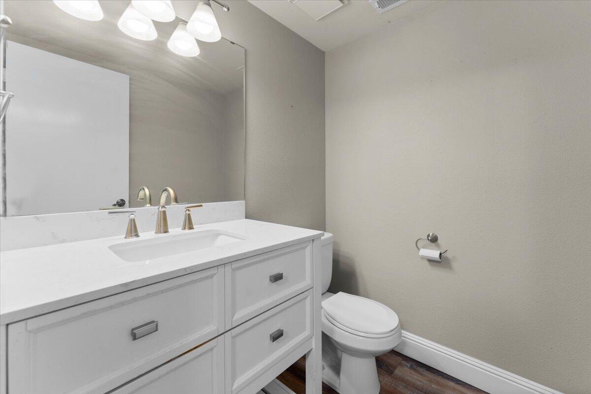 1968 Bechelli Lane Redding, CA 96002 - Photo 21 of 32 a bathroom with a sink a toilet and mirror