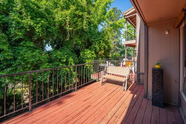 a view of balcony with wooden floor and outdoor space
