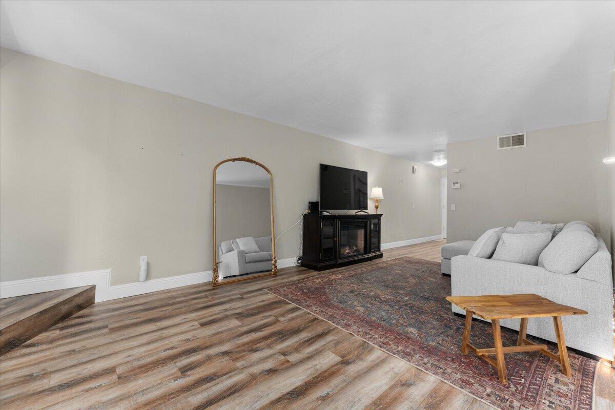 1968 Bechelli Lane Redding, CA 96002 - Photo 6 of 32 a living room with furniture and a fireplace