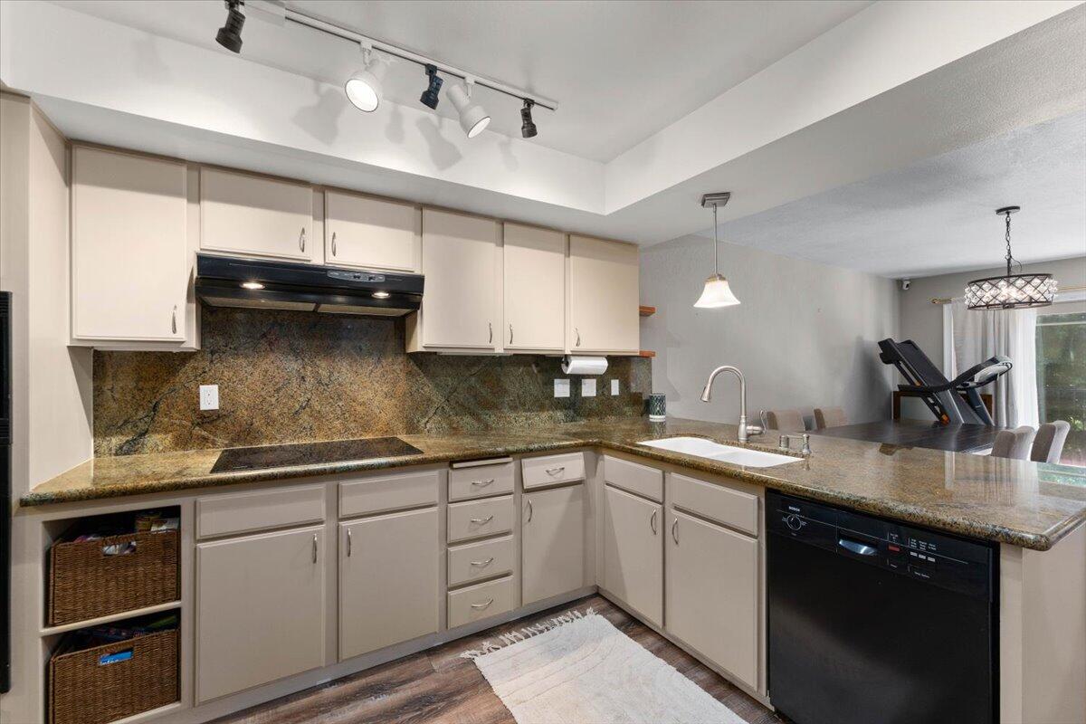 1968 Bechelli Lane Redding, CA 96002 - Photo 9 of 32 a kitchen with a sink dishwasher and white cabinets with wooden floor
