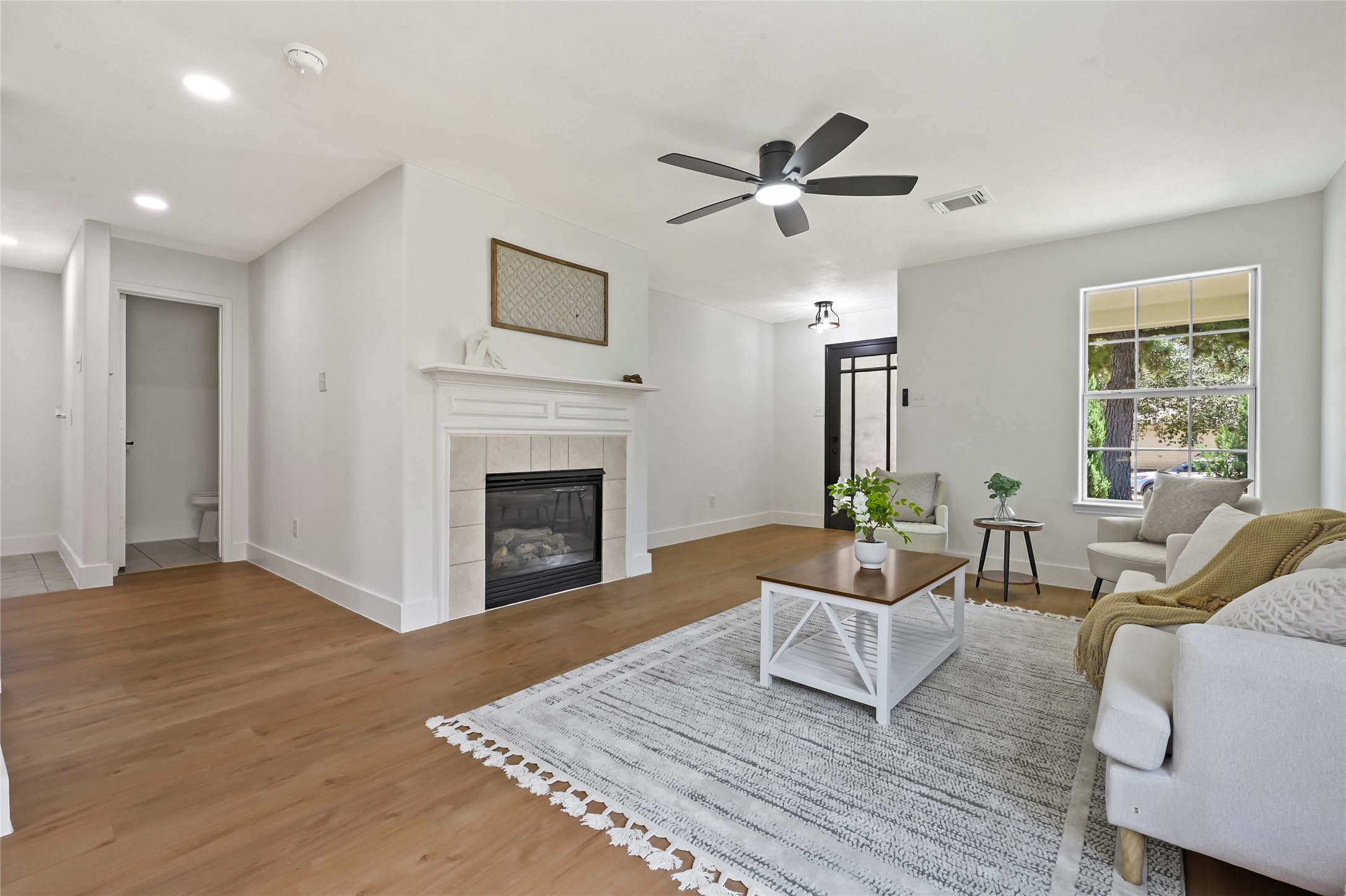 23311 Leafstone Lane Spring, TX 77373 - Photo 6 of 35 Cozy gas fireplace adds warmth and charm to the living area.