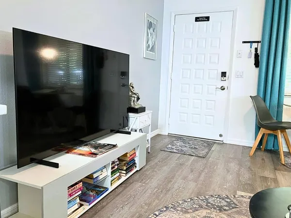a room with furniture and a flat screen tv