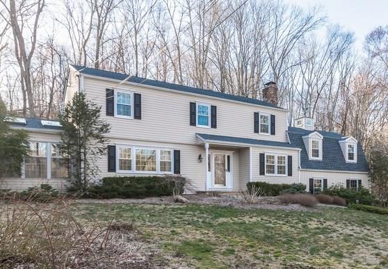 50 Cobbs Mill Road Wilton, CT 06897 - Photo 1 of 1 a front view of a house with a yard