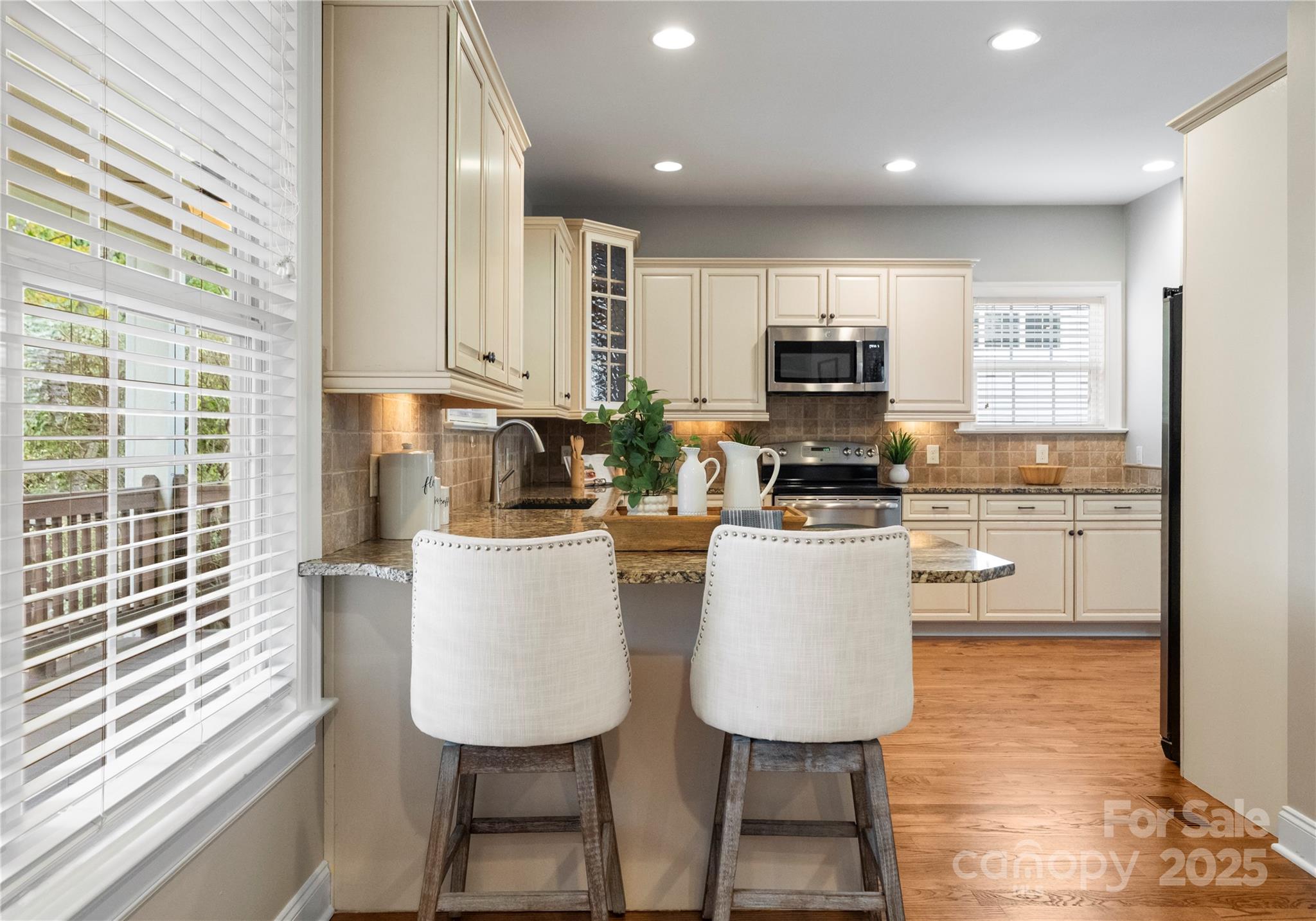2105 Lanier Avenue Charlotte, NC 28205 - Photo 13 of 31 a kitchen with a sink cabinets and window
