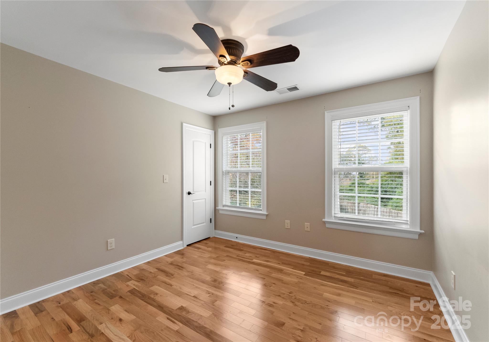 2105 Lanier Avenue Charlotte, NC 28205 - Photo 26 of 31 a view of an empty room with wooden floor and a window