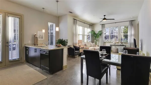 a view of a dining room with furniture window and outside view