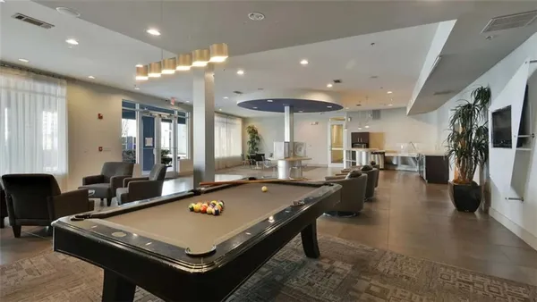 a swimming pool with outdoor seating and yard