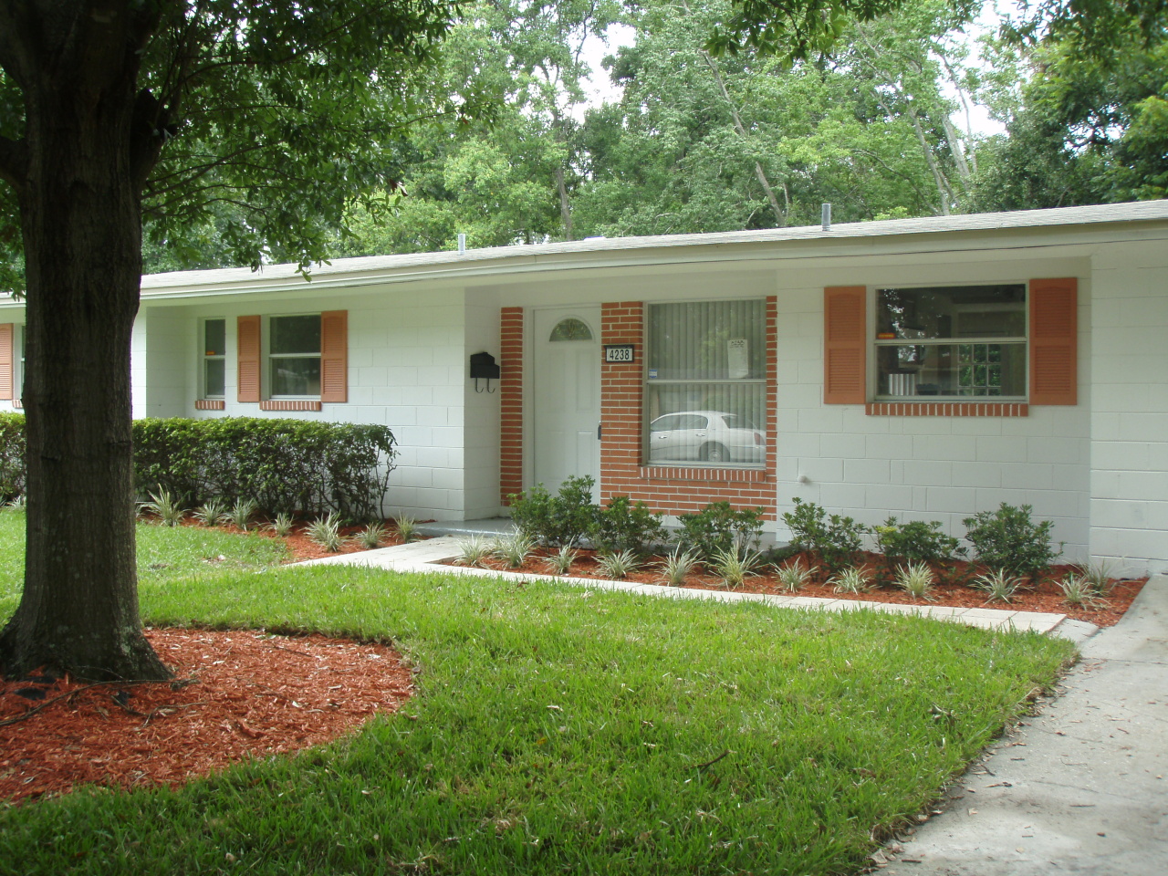 4238 Glenview Road Jacksonville, FL 32207 - Photo 1 of 6 a front view of a house with garden