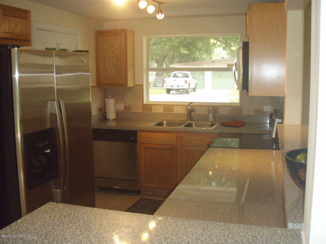 4238 Glenview Road Jacksonville, FL 32207 - Photo 2 of 6 a bathroom with shower a window and a sink