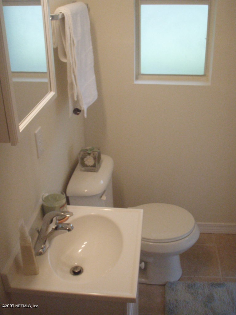 4238 Glenview Road Jacksonville, FL 32207 - Photo 4 of 6 a bathroom with a sink and a toilet