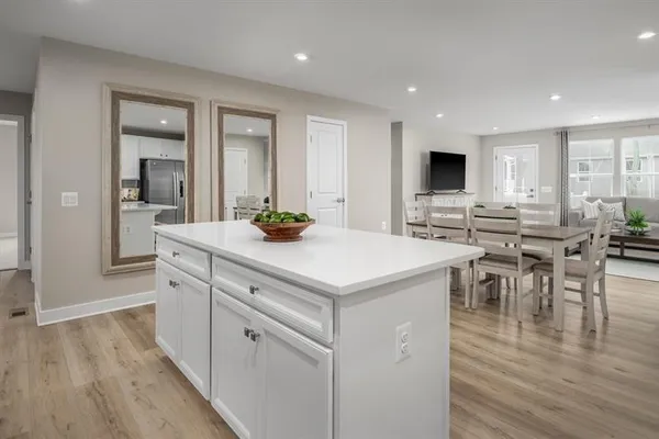 a kitchen with a sink a counter top space and stainless steel appliances