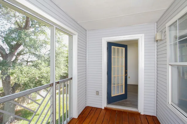 a view of front door with wooden floor