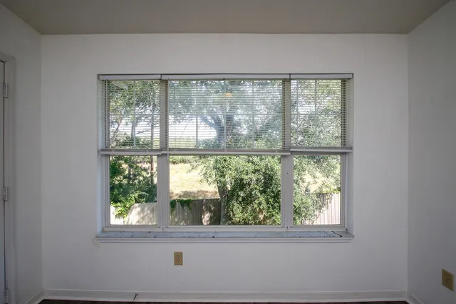 a view of a room that has a window