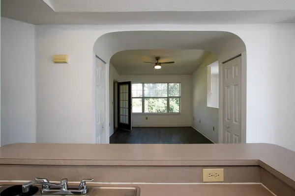 a view of a hallway with a window