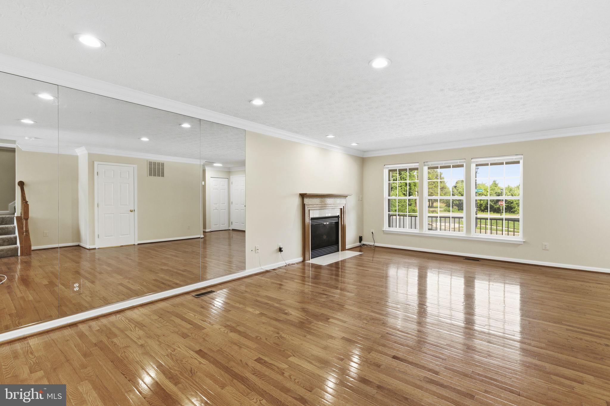 2801 Profitt Path Edgewood, MD 21040 - Photo 2 of 32 a view of an empty room with a window and wooden floor