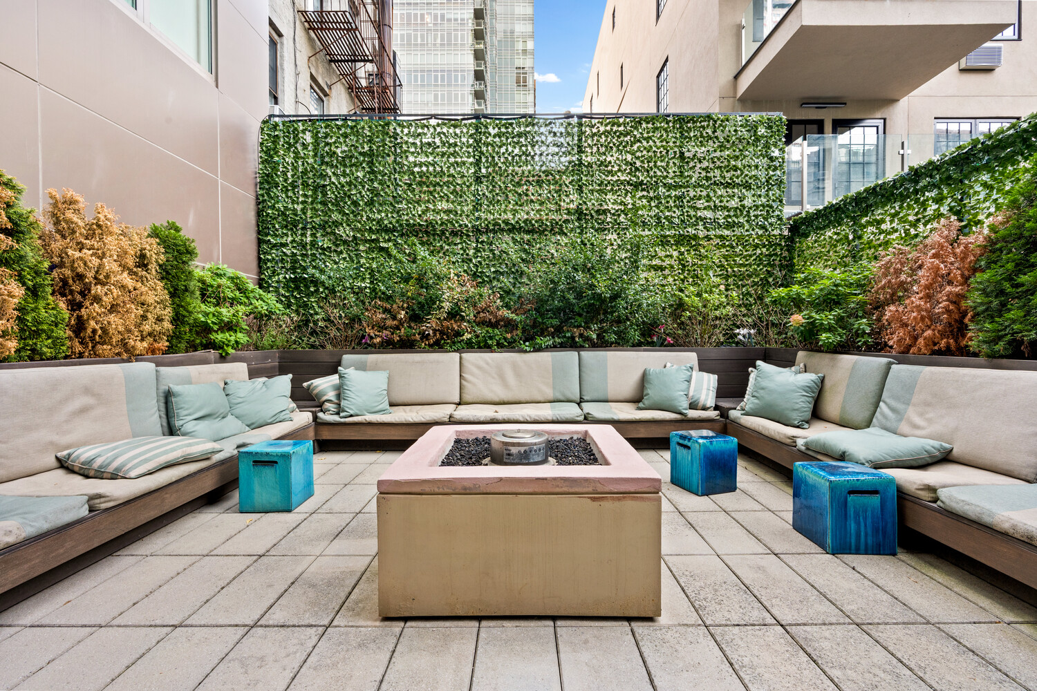 305 East 51st Street, Unit RU5H Manhattan, NY 10022 - Photo 11 of 14 a view of a roof deck with couches and potted plants