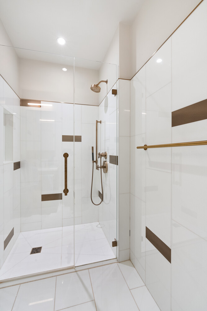 305 East 51st Street, Unit RU5H Manhattan, NY 10022 - Photo 9 of 14 a bathroom with a glass shower door