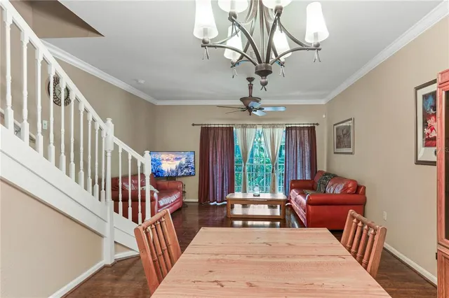 a view of a livingroom with furniture and wooden floor