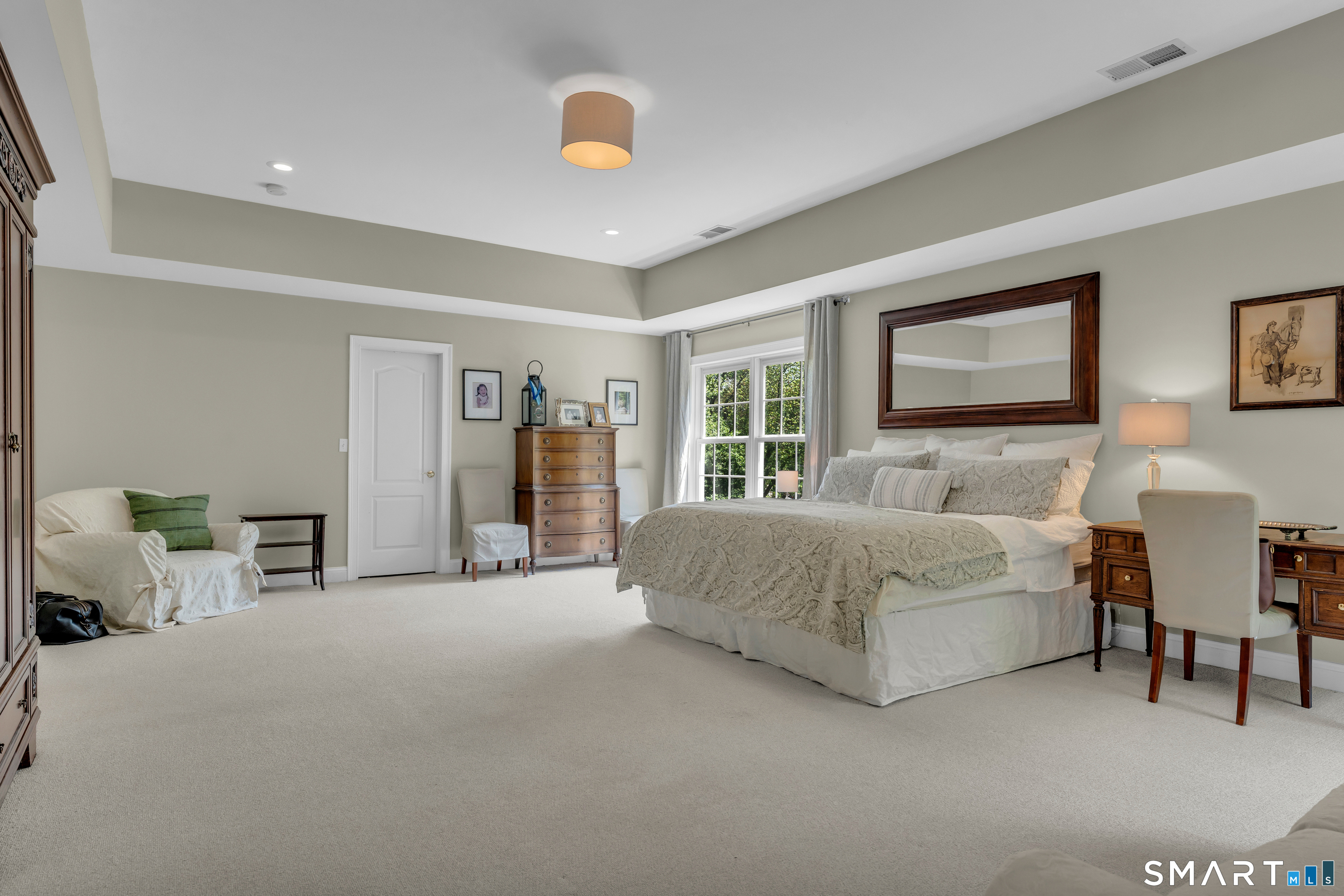 474 State Street Guilford, CT 06437 - Photo 20 of 40 a spacious bedroom with a bed and a couch